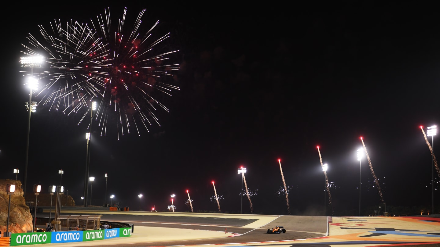BAHRAIN, BAHRAIN - DECEMBER 06: Fireworks over the circuit as Carlos Sainz of Spain driving the