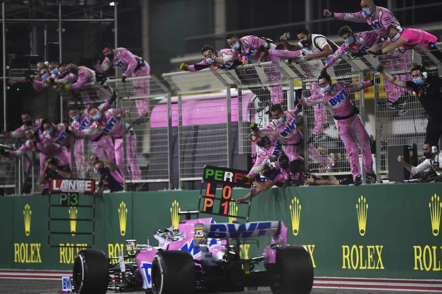 BAHRAIN, BAHRAIN - DECEMBER 06: The Racing Point team celebrate on the pitwall as Sergio Perez of