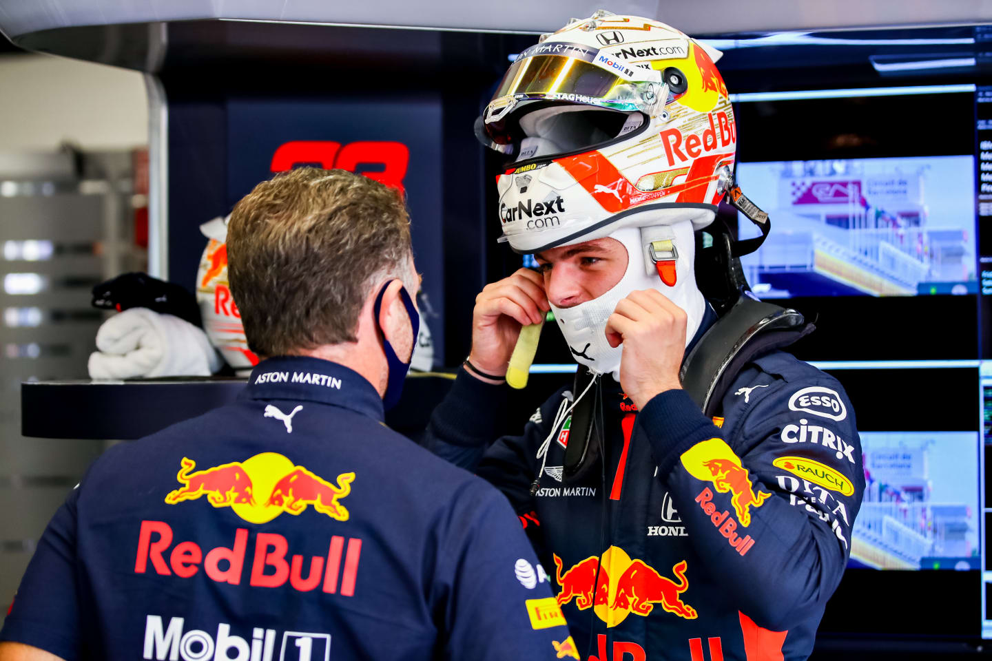 BARCELONA, SPAIN - AUGUST 14: Max Verstappen of Netherlands and Red Bull Racing talks with Red Bull