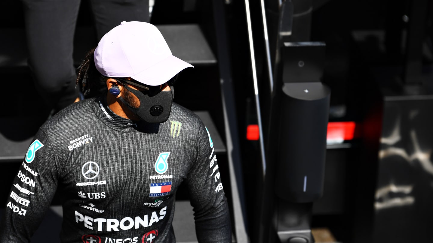 BARCELONA, SPAIN - AUGUST 14: Lewis Hamilton of Great Britain and Mercedes GP walks to the garage