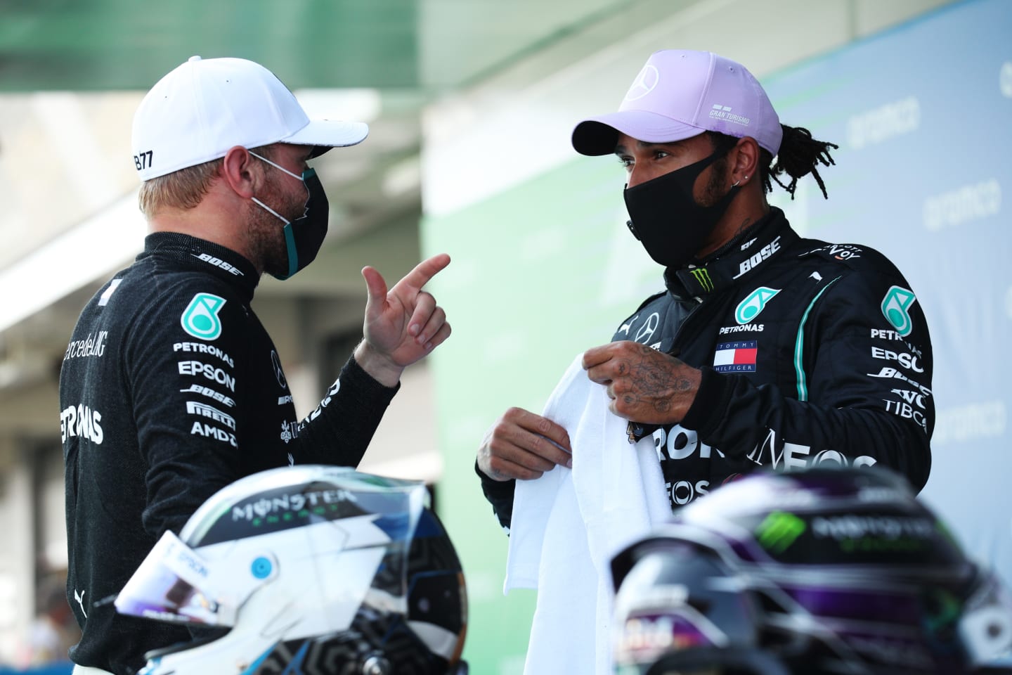 BARCELONA, SPAIN - AUGUST 15: Pole position qualifier Lewis Hamilton of Great Britain and Mercedes GP talks to second placed qualifier Valtteri Bottas of Finland and Mercedes GP during qualifying for the F1 Grand Prix of Spain at Circuit de Barcelona-Catalunya on August 15, 2020 in Barcelona, Spain. (Photo by Albert Gea/Pool via Getty Images)