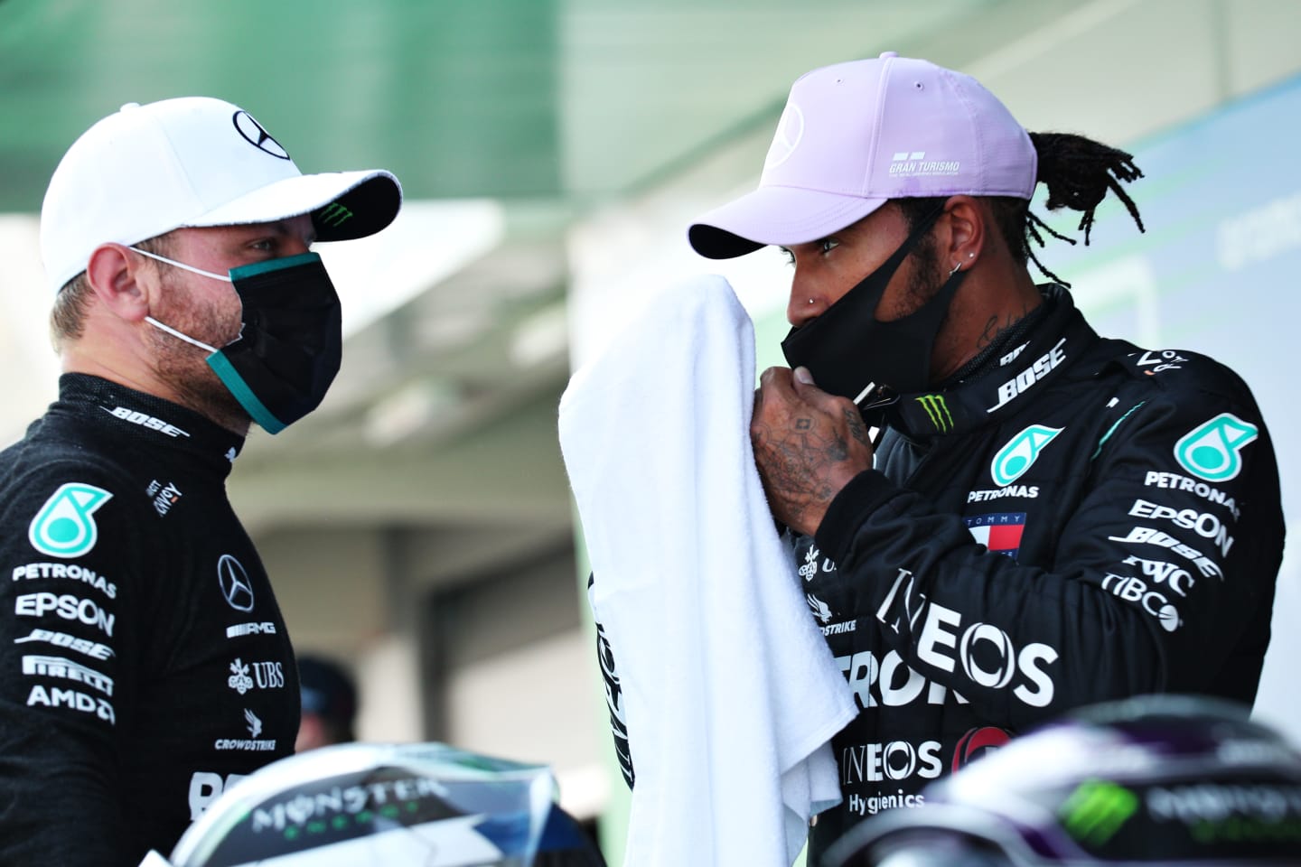 BARCELONA, SPAIN - AUGUST 15: Pole position qualifier Lewis Hamilton of Great Britain and Mercedes GP talks to second placed qualifier Valtteri Bottas of Finland and Mercedes GP during qualifying for the F1 Grand Prix of Spain at Circuit de Barcelona-Catalunya on August 15, 2020 in Barcelona, Spain. (Photo by Albert Gea/Pool via Getty Images)