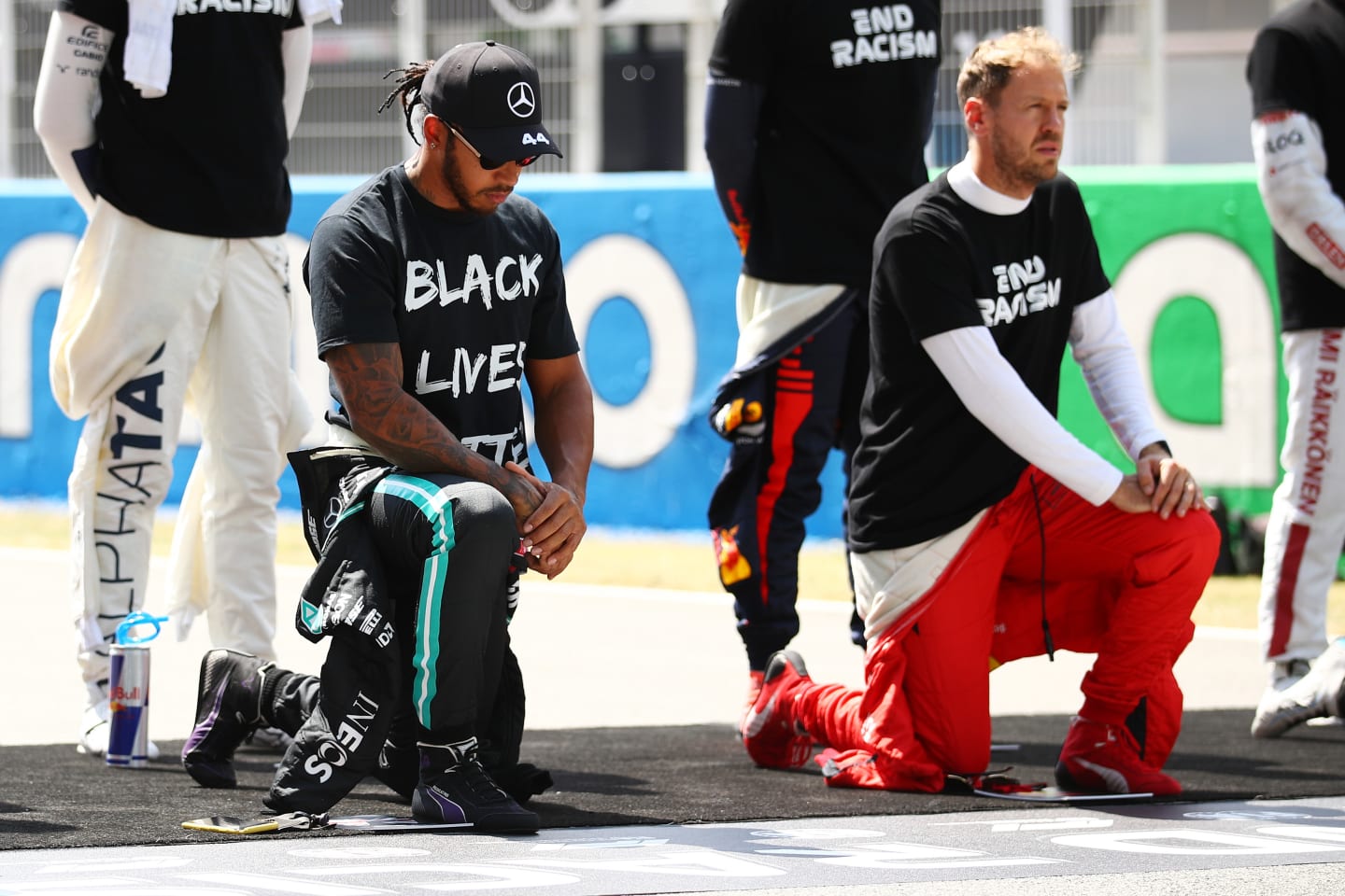 BARCELONA, SPAIN - AUGUST 16: Lewis Hamilton of Great Britain and Mercedes GP takes a knee on the