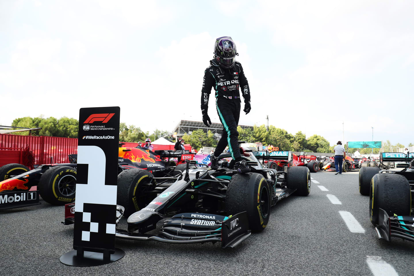 BARCELONA, SPAIN - AUGUST 16: Race winner Lewis Hamilton of Great Britain and Mercedes GP steps off