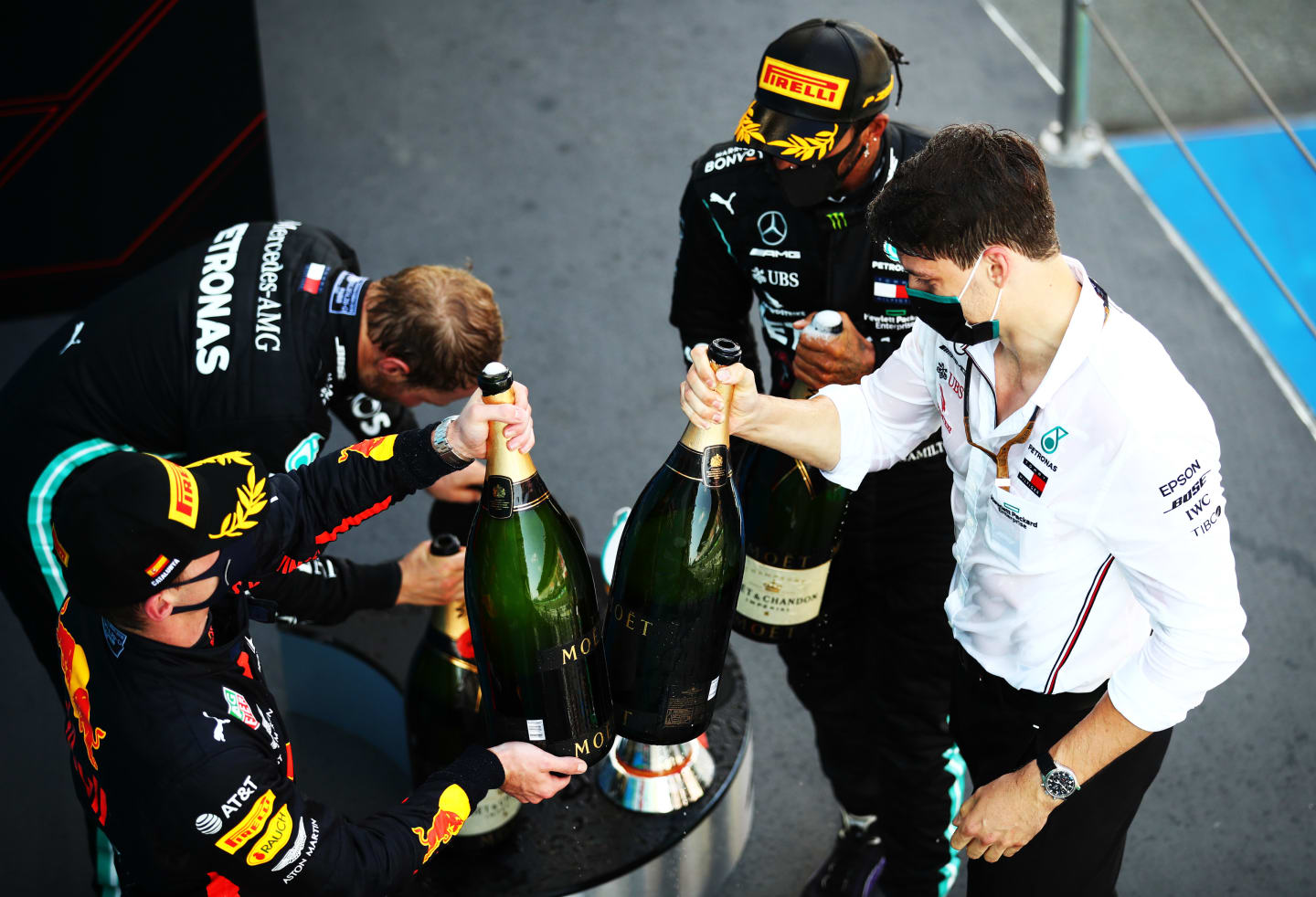 BARCELONA, SPAIN - AUGUST 16: Race winner Lewis Hamilton of Great Britain and Mercedes GP,  second placed Max Verstappen of Netherlands and Red Bull Racing and third placed Valtteri Bottas of Finland and Mercedes GP celebrate on the podium during the F1 Grand Prix of Spain at Circuit de Barcelona-Catalunya on August 16, 2020 in Barcelona, Spain. (Photo by Bryn Lennon/Getty Images)
