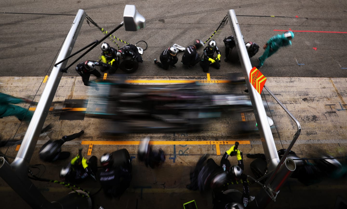 BARCELONA, SPAIN - AUGUST 16: Lewis Hamilton of Great Britain driving the (44) Mercedes AMG Petronas F1 Team Mercedes W11 comes in for a tyre change during the F1 Grand Prix of Spain at Circuit de Barcelona-Catalunya on August 16, 2020 in Barcelona, Spain. (Photo by Albert Gea/Pool via Getty Images)