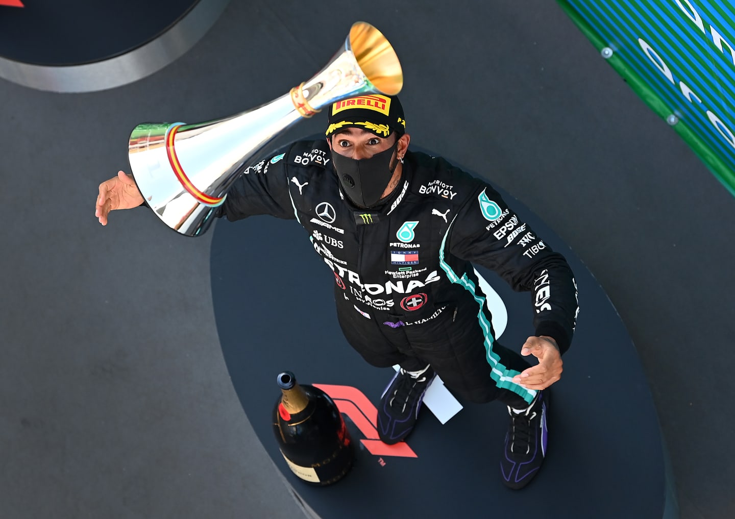 BARCELONA, SPAIN - AUGUST 16: Race winner Lewis Hamilton of Great Britain and Mercedes GP celebrates on the podium by throwing his trophy in the air during the F1 Grand Prix of Spain at Circuit de Barcelona-Catalunya on August 16, 2020 in Barcelona, Spain. (Photo by Clive Mason - Formula 1/Formula 1 via Getty Images)