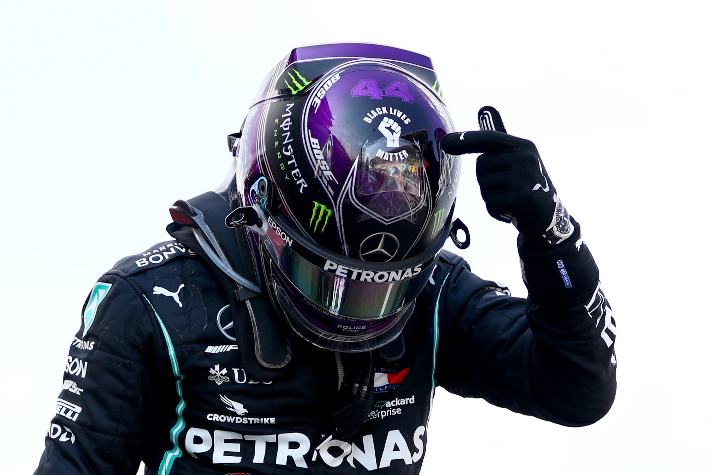 BARCELONA, SPAIN - AUGUST 16: Race winner Lewis Hamilton of Great Britain and Mercedes GP points to the 'Black Lives Matter' symbol on his helmet as he celebrates in parc ferme during the F1 Grand Prix of Spain at Circuit de Barcelona-Catalunya on August 16, 2020 in Barcelona, Spain. (Photo by Dan Istitene - Formula 1/Formula 1 via Getty Images)