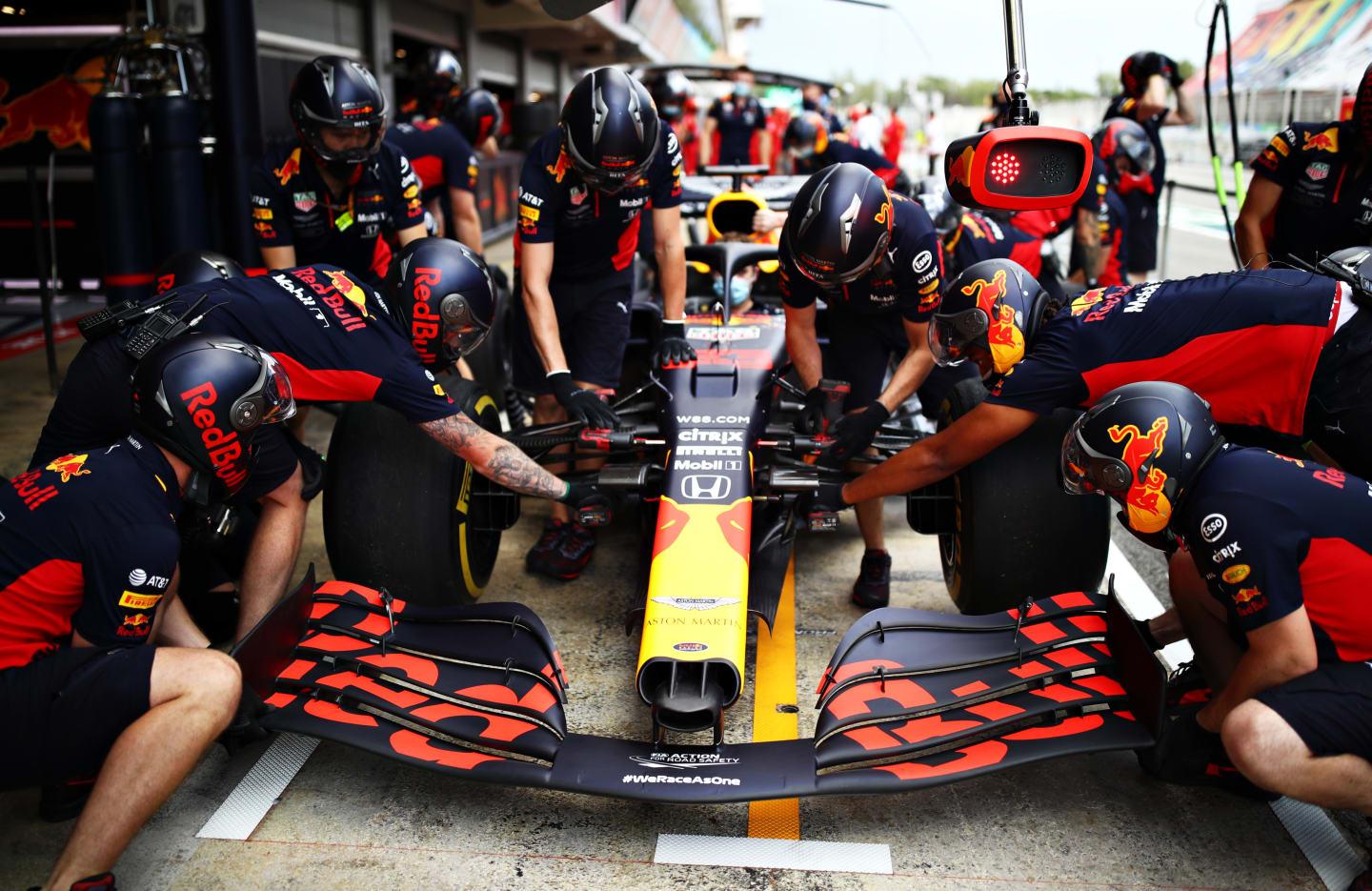 BARCELONA, SPAIN - AUGUST 13: The Red Bull Racing team practice pitstops during previews ahead of