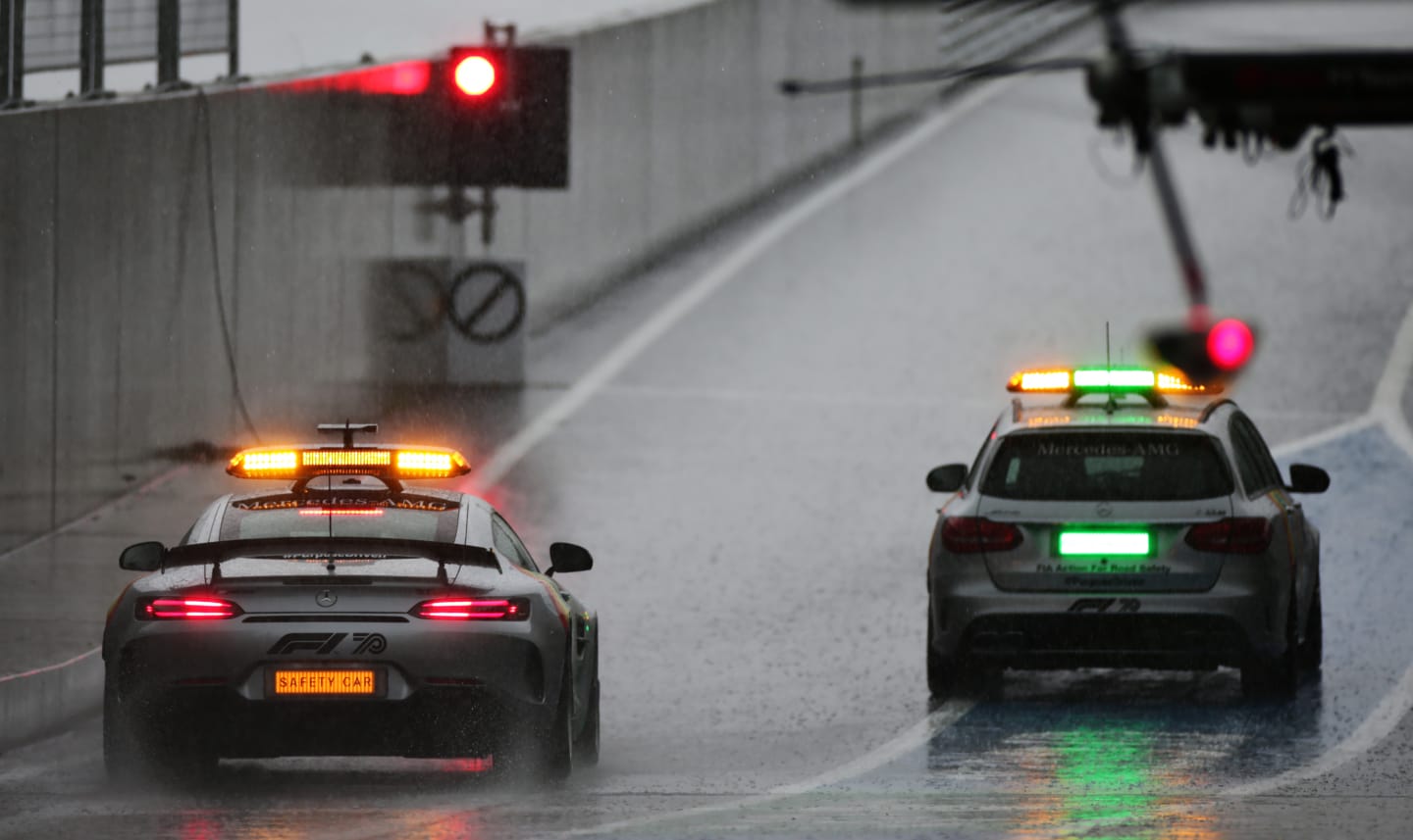 SPIELBERG, AUSTRIA - JULY 11: The safety car and medical car sit at the end of the pitlane in the