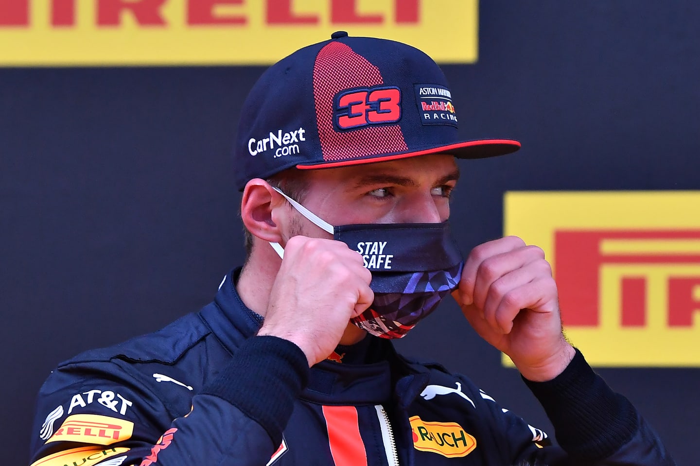 SPIELBERG, AUSTRIA - JULY 11: Second placed qualifier Max Verstappen of Netherlands and Red Bull Racing puts on his mask in parc ferme during qualifying for the Formula One Grand Prix of Styria at Red Bull Ring on July 11, 2020 in Spielberg, Austria. (Photo by Joe Klamar/Pool via Getty Images)