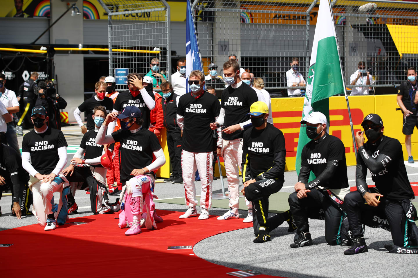 SPIELBERG, AUSTRIA - JULY 12: Some drivers take a knee on the grid in support of the Black Lives