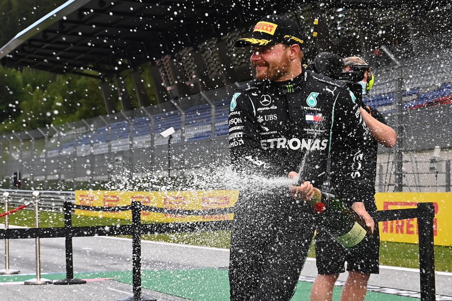 SPIELBERG, AUSTRIA - JULY 12: Second placed Valtteri Bottas of Finland and Mercedes GP celebrates on the podium after the Formula One Grand Prix of Styria at Red Bull Ring on July 12, 2020 in Spielberg, Austria. (Photo by Joe Klamar/Pool via Getty Images)