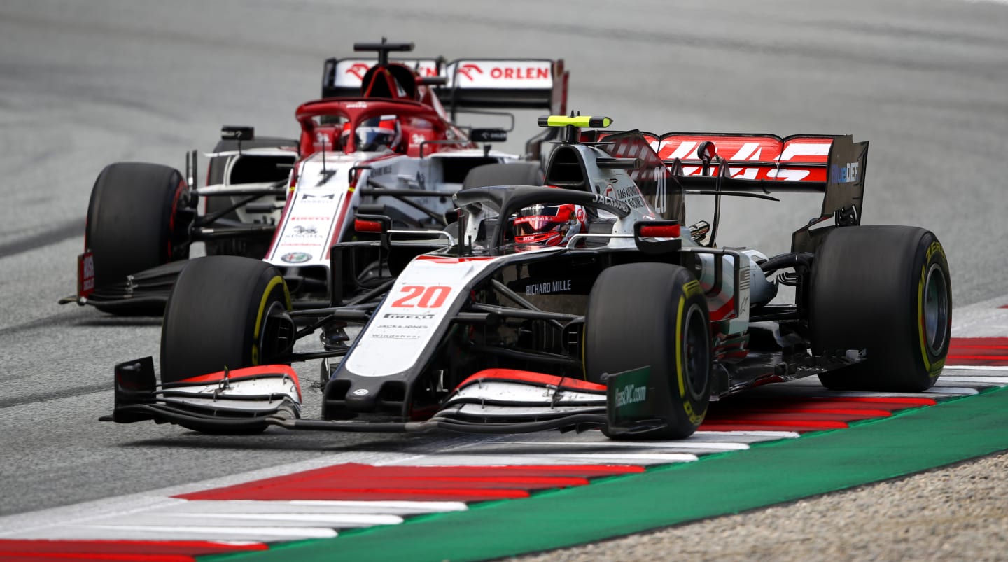 SPIELBERG, AUSTRIA - JULY 12: Kevin Magnussen of Denmark driving the (20) Haas F1 Team VF-20 Ferrari battles for position with Kimi Raikkonen of Finland driving the (7) Alfa Romeo Racing C39 Ferrari during the Formula One Grand Prix of Styria at Red Bull Ring on July 12, 2020 in Spielberg, Austria. (Photo by Bryn Lennon/Getty Images)