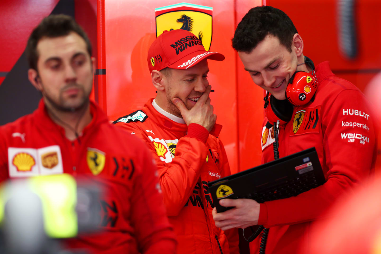 BARCELONA, SPAIN - FEBRUARY 21: Sebastian Vettel of Germany and Ferrari speaks to a Ferrari team
