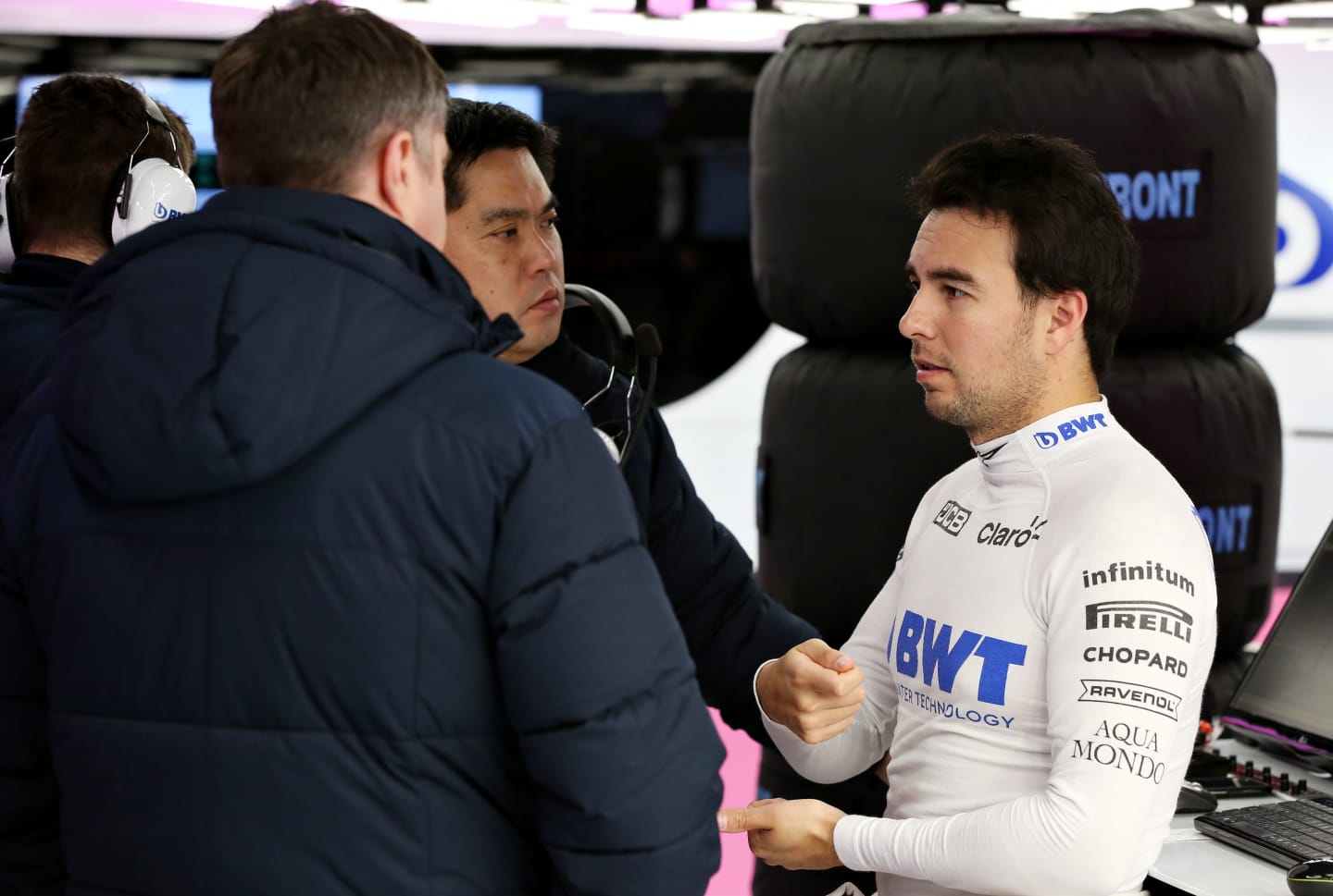 BARCELONA, SPAIN - FEBRUARY 28: Sergio Perez of Mexico and Racing Point talks with engineers in the