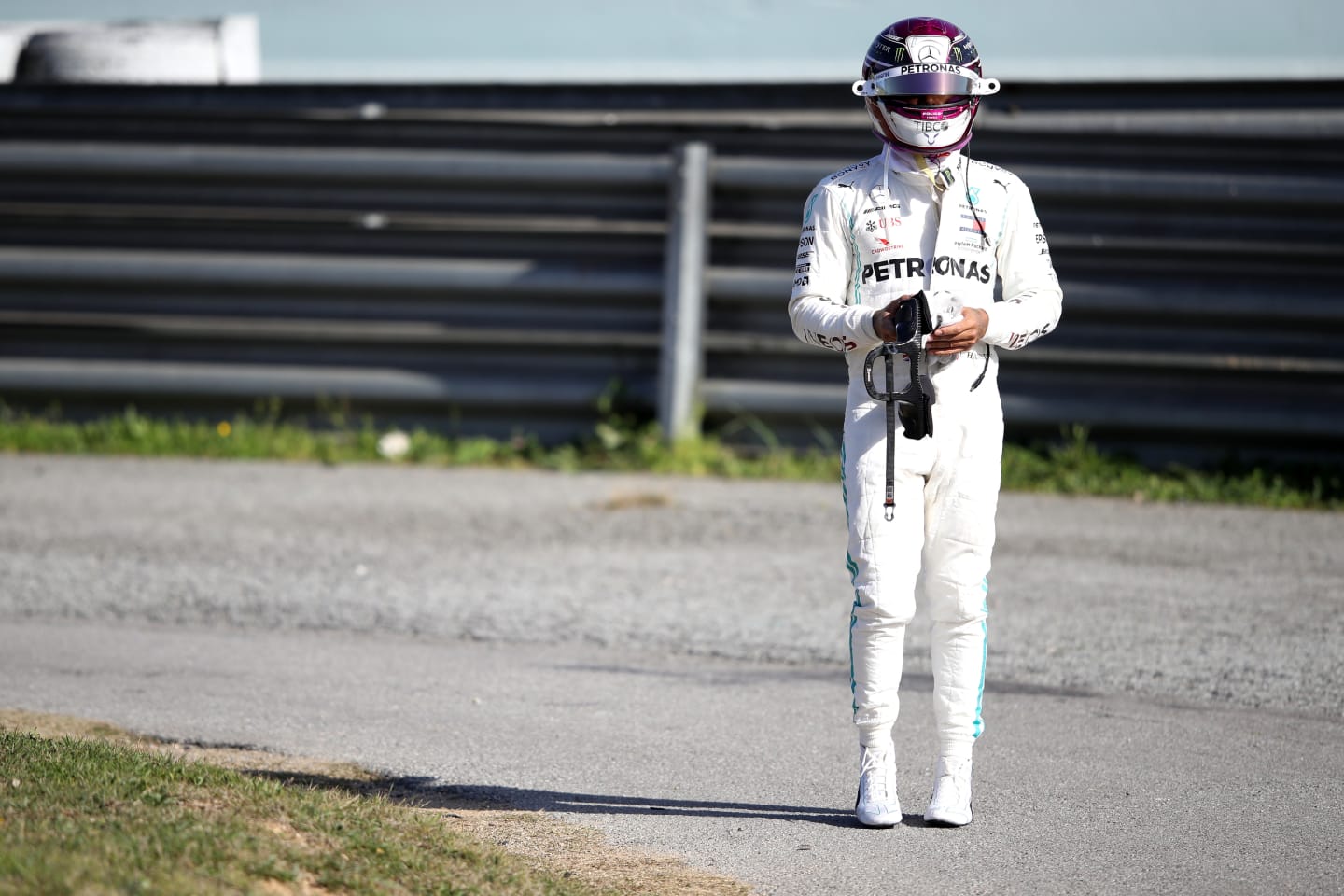 BARCELONA, SPAIN - FEBRUARY 27: Lewis Hamilton of Great Britain and Mercedes GP walks on a circuit