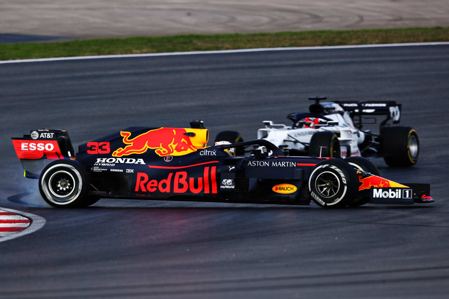 ISTANBUL, TURKEY - NOVEMBER 13: Max Verstappen of the Netherlands driving the (33) Aston Martin Red Bull Racing RB16 spins in front of Daniil Kvyat of Russia driving the (26) Scuderia AlphaTauri AT01 Honda during practice ahead of the F1 Grand Prix of Turkey at Intercity Istanbul Park on November 13, 2020 in Istanbul, Turkey. (Photo by Joe Portlock - Formula 1/Formula 1 via Getty Images)