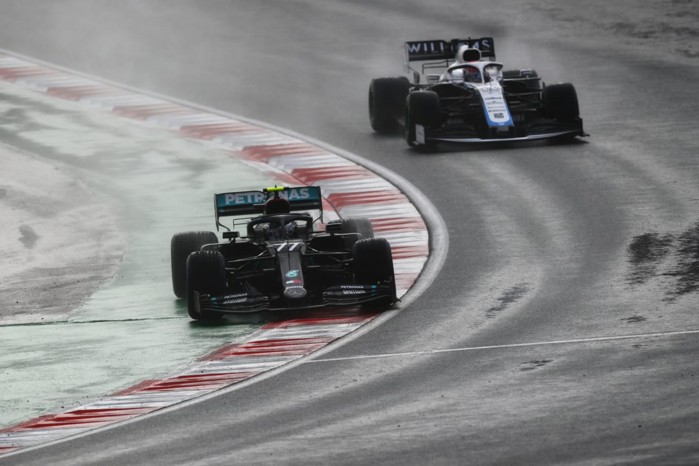 ISTANBUL, TURKEY - NOVEMBER 15: Valtteri Bottas of Finland driving the (77) Mercedes AMG Petronas F1 Team Mercedes W11 leads George Russell of Great Britain driving the (63) Williams Racing FW43 Mercedes during the F1 Grand Prix of Turkey at Intercity Istanbul Park on November 15, 2020 in Istanbul, Turkey. (Photo by Clive Mason/Getty Images)