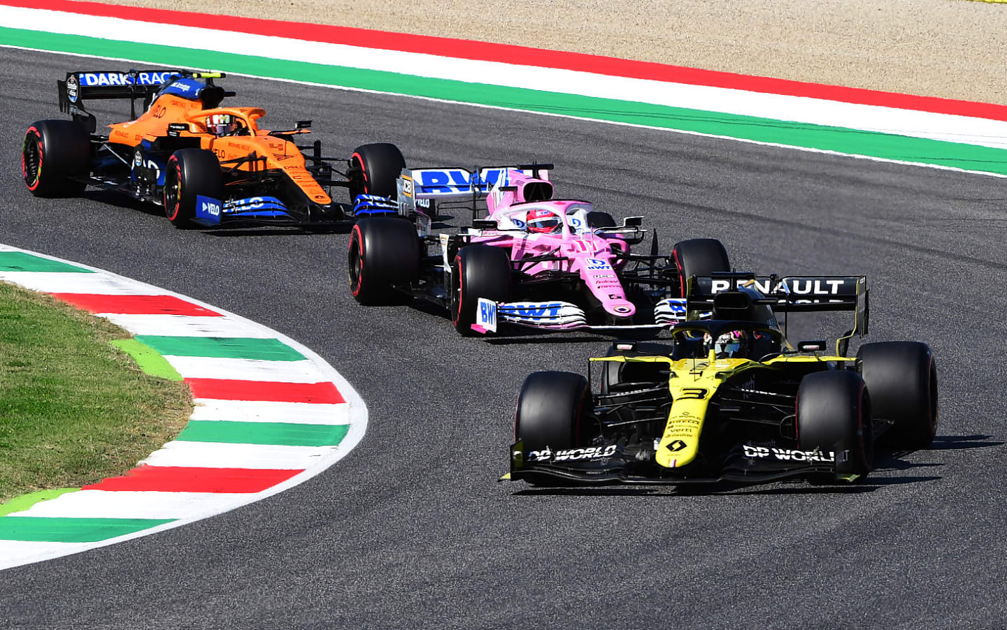 SCARPERIA, ITALY - SEPTEMBER 13: Daniel Ricciardo of Australia driving the (3) Renault Sport Formula One Team RS20 leads Sergio Perez of Mexico driving the (11) Racing Point RP20 Mercedes and Lando Norris of Great Britain driving the (4) McLaren F1 Team MCL35 Renault during the F1 Grand Prix of Tuscany at Mugello Circuit on September 13, 2020 in Scarperia, Italy. (Photo by Jenifer Lorenzini - Pool/Getty Images)