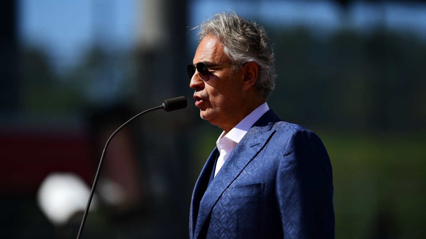 SCARPERIA, ITALY - SEPTEMBER 13: Opera star Andrea Bocelli sings the national anthem on the grid
