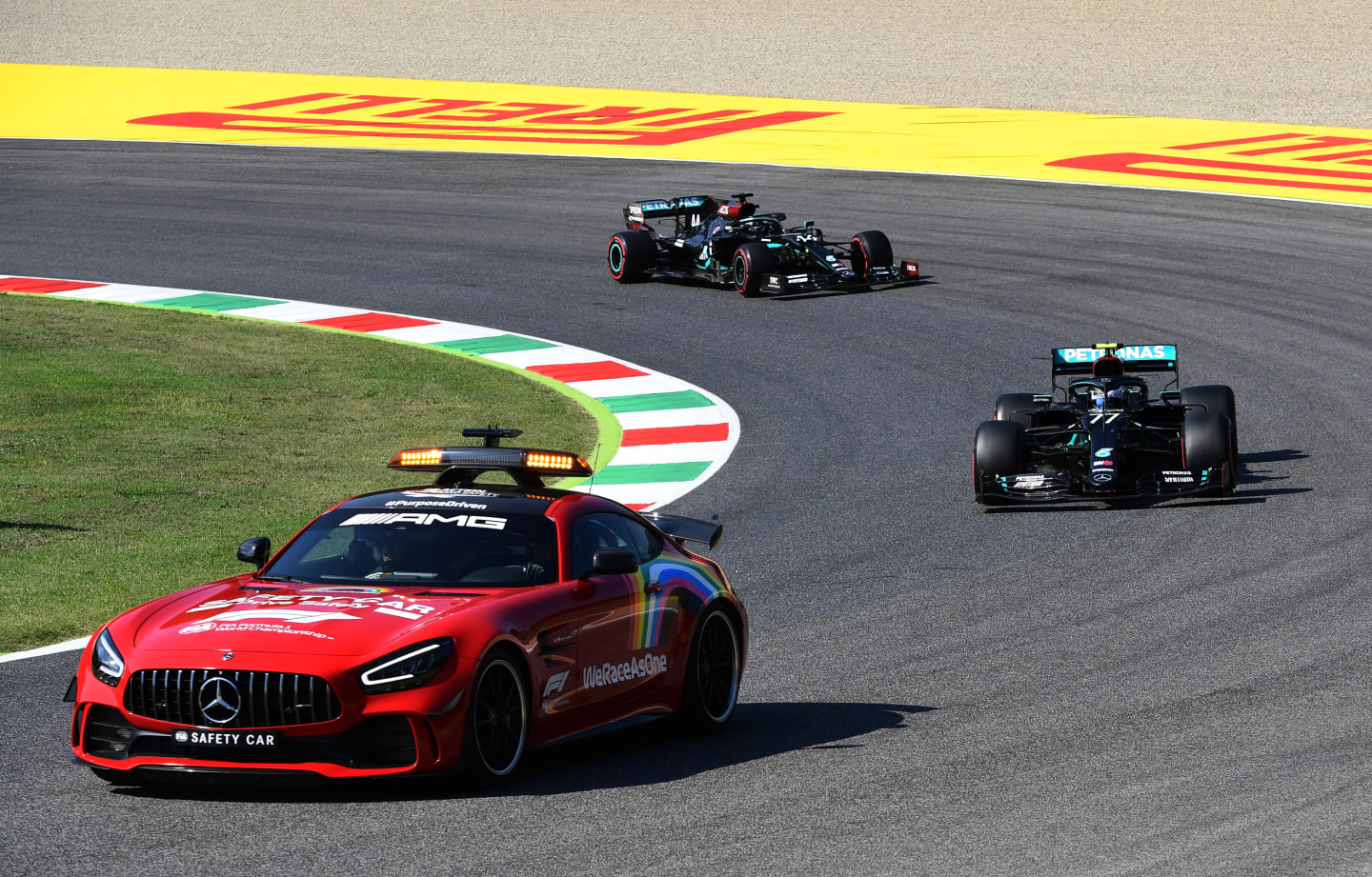 SCARPERIA, ITALY - SEPTEMBER 13: An FIA safety car leads Valtteri Bottas of Finland driving the