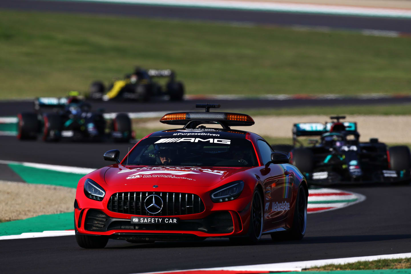 SCARPERIA, ITALY - SEPTEMBER 13: An FIA safety car leads Valtteri Bottas of Finland driving the
