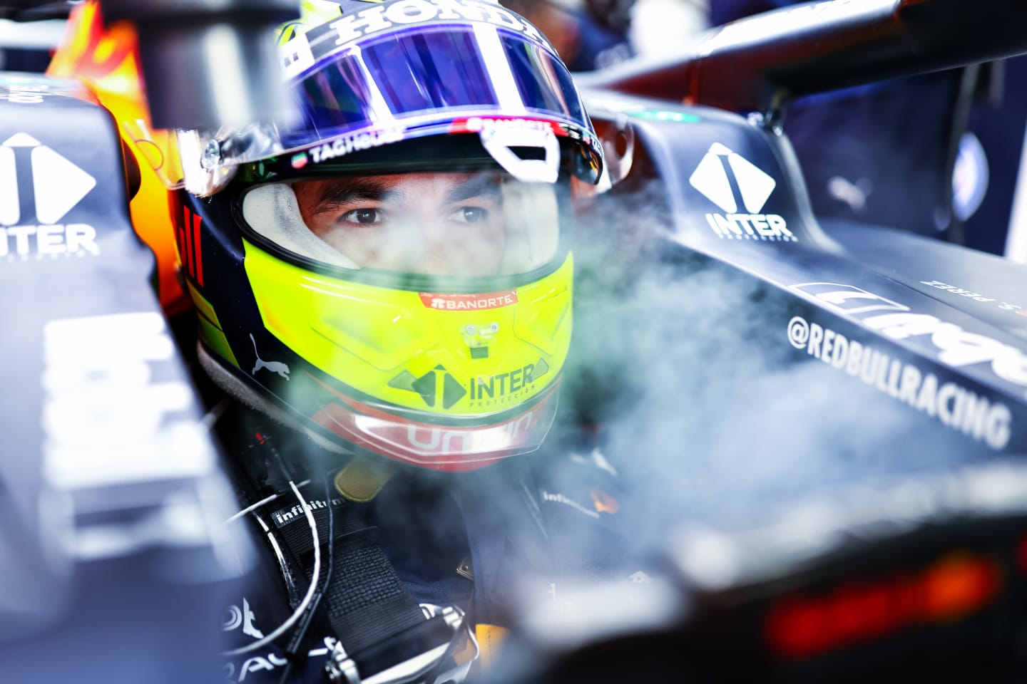 ABU DHABI, UNITED ARAB EMIRATES - DECEMBER 10: Sergio Perez of Mexico and Red Bull Racing prepares to drive in the garage during practice ahead of the F1 Grand Prix of Abu Dhabi at Yas Marina Circuit on December 10, 2021 in Abu Dhabi, United Arab Emirates. (Photo by Mark Thompson/Getty Images)