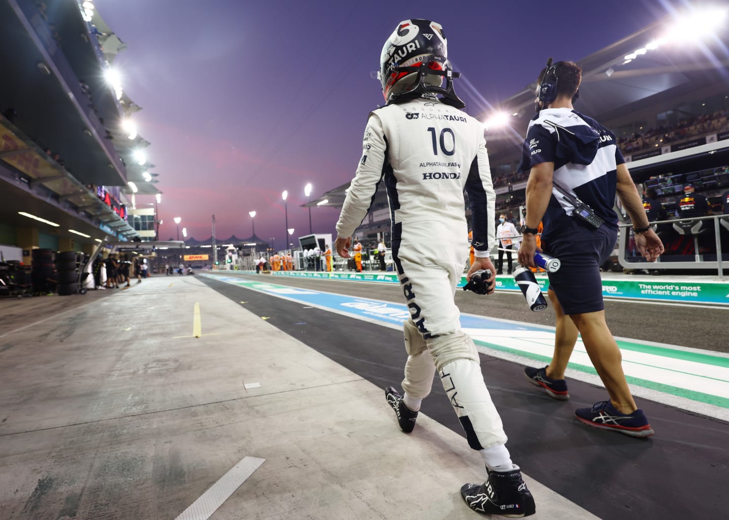 ABU DHABI, UNITED ARAB EMIRATES - DECEMBER 11: Pierre Gasly of France and Scuderia AlphaTauri walks in the Pitlane during qualifying ahead of the F1 Grand Prix of Abu Dhabi at Yas Marina Circuit on December 11, 2021 in Abu Dhabi, United Arab Emirates. (Photo by Mark Thompson/Getty Images)