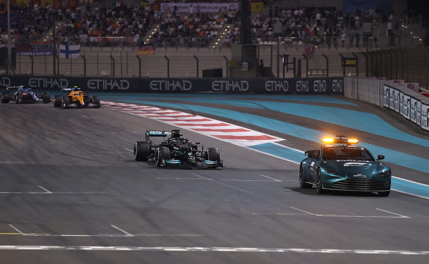 ABU DHABI, UNITED ARAB EMIRATES - DECEMBER 12: The FIA Safety Car leads Lewis Hamilton of Great