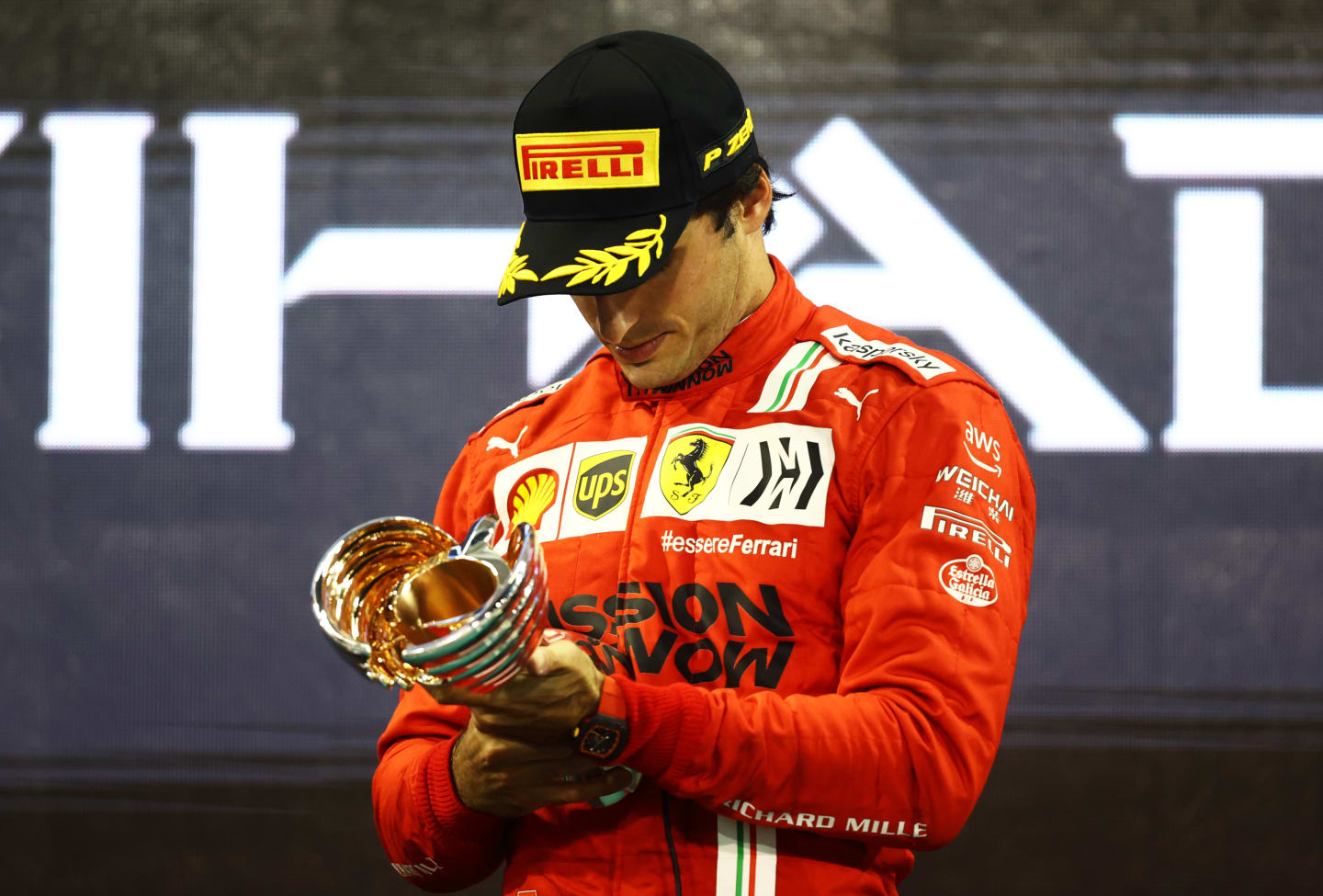 ABU DHABI, UNITED ARAB EMIRATES - DECEMBER 12: Third placed Carlos Sainz of Spain and Ferrari