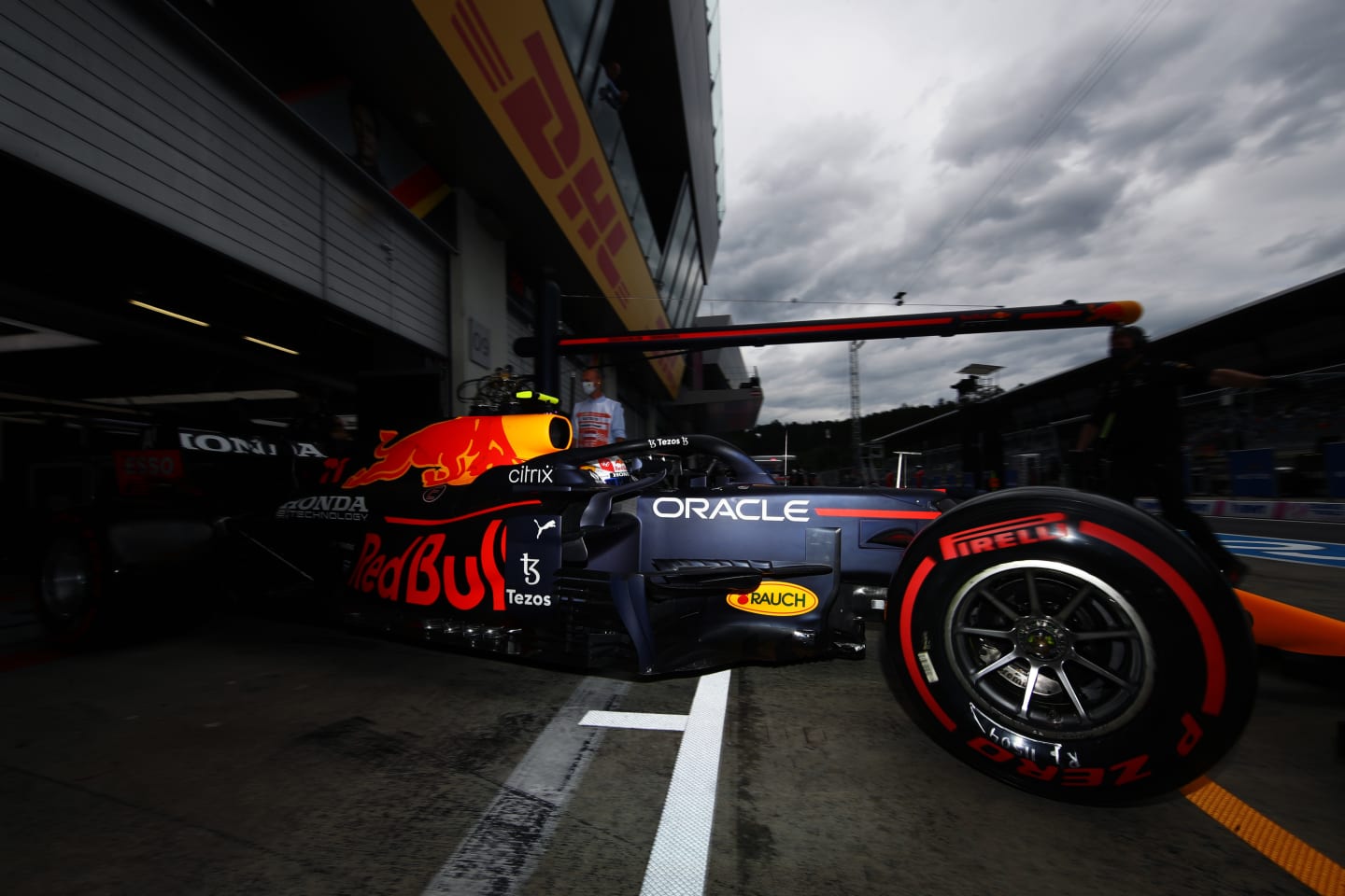 SPIELBERG, AUSTRIA - JULY 02: Sergio Perez of Mexico driving the (11) Red Bull Racing RB16B Honda leaves the garage during practice ahead of the F1 Grand Prix of Austria at Red Bull Ring on July 02, 2021 in Spielberg, Austria. (Photo by Mark Thompson/Getty Images)