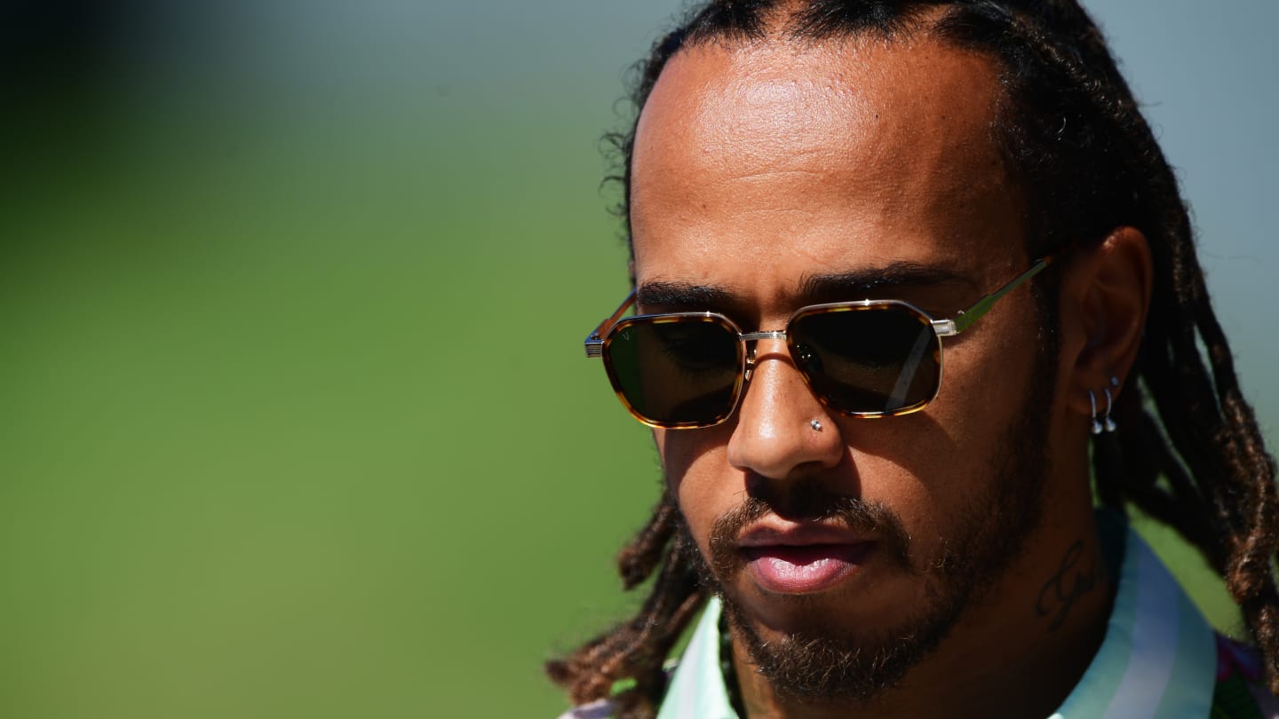 SPIELBERG, AUSTRIA - JULY 03: Lewis Hamilton of Great Britain and Mercedes GP walks in the Paddock