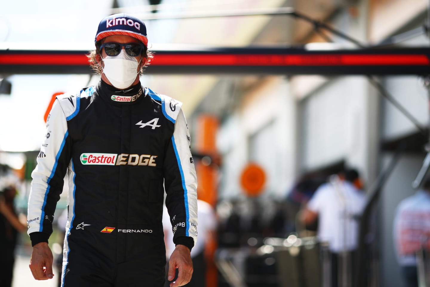 SPIELBERG, AUSTRIA - JULY 03: Fernando Alonso of Spain and Alpine F1 Team walks in the Pitlane during qualifying ahead of the F1 Grand Prix of Austria at Red Bull Ring on July 03, 2021 in Spielberg, Austria. (Photo by Mark Thompson/Getty Images)