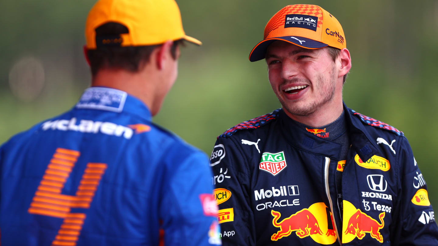 SPIELBERG, AUSTRIA - JULY 03: Pole position qualifier Max Verstappen of Netherlands and Red Bull Racing and second place qualifier Lando Norris of Great Britain and McLaren F1 talk in parc ferme during qualifying ahead of the F1 Grand Prix of Austria at Red Bull Ring on July 03, 2021 in Spielberg, Austria. (Photo by Dan Istitene - Formula 1/Formula 1 via Getty Images)