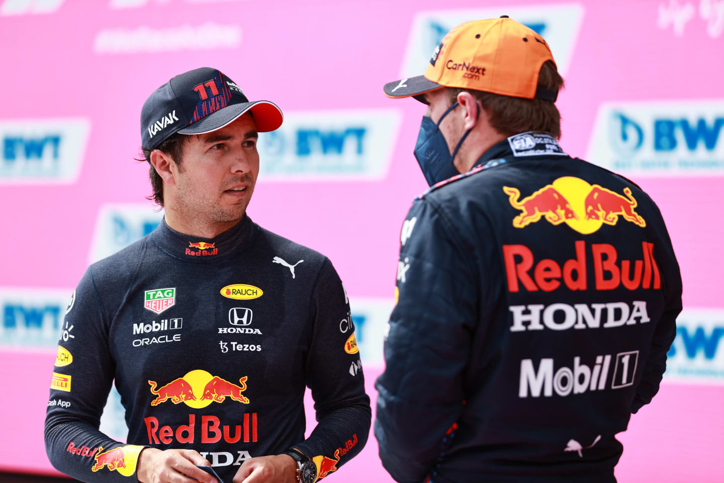 SPIELBERG, AUSTRIA - JULY 03: Pole position qualifier Max Verstappen of Netherlands and Red Bull Racing and third place qualifier Sergio Perez of Mexico and Red Bull Racing celebrate in parc ferme during qualifying ahead of the F1 Grand Prix of Austria at Red Bull Ring on July 03, 2021 in Spielberg, Austria. (Photo by Mark Thompson/Getty Images)