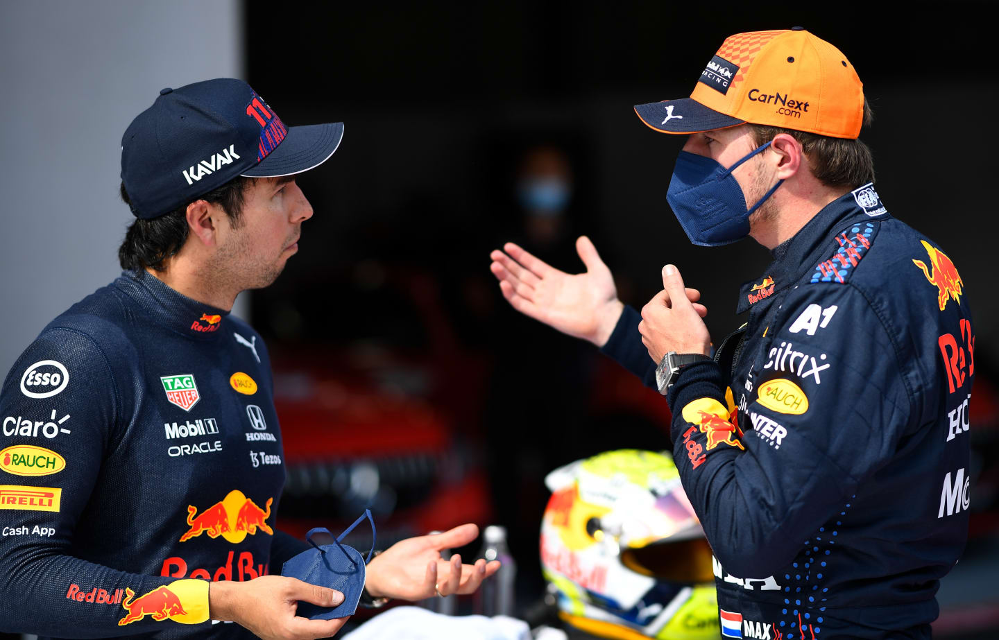 SPIELBERG, AUSTRIA - JULY 03: Pole position qualifier Max Verstappen of Netherlands and Red Bull Racing and third place qualifier Sergio Perez of Mexico and Red Bull Racing celebrate in parc ferme during qualifying ahead of the F1 Grand Prix of Austria at Red Bull Ring on July 03, 2021 in Spielberg, Austria. (Photo by Christian Bruna - Pool/Getty Images)