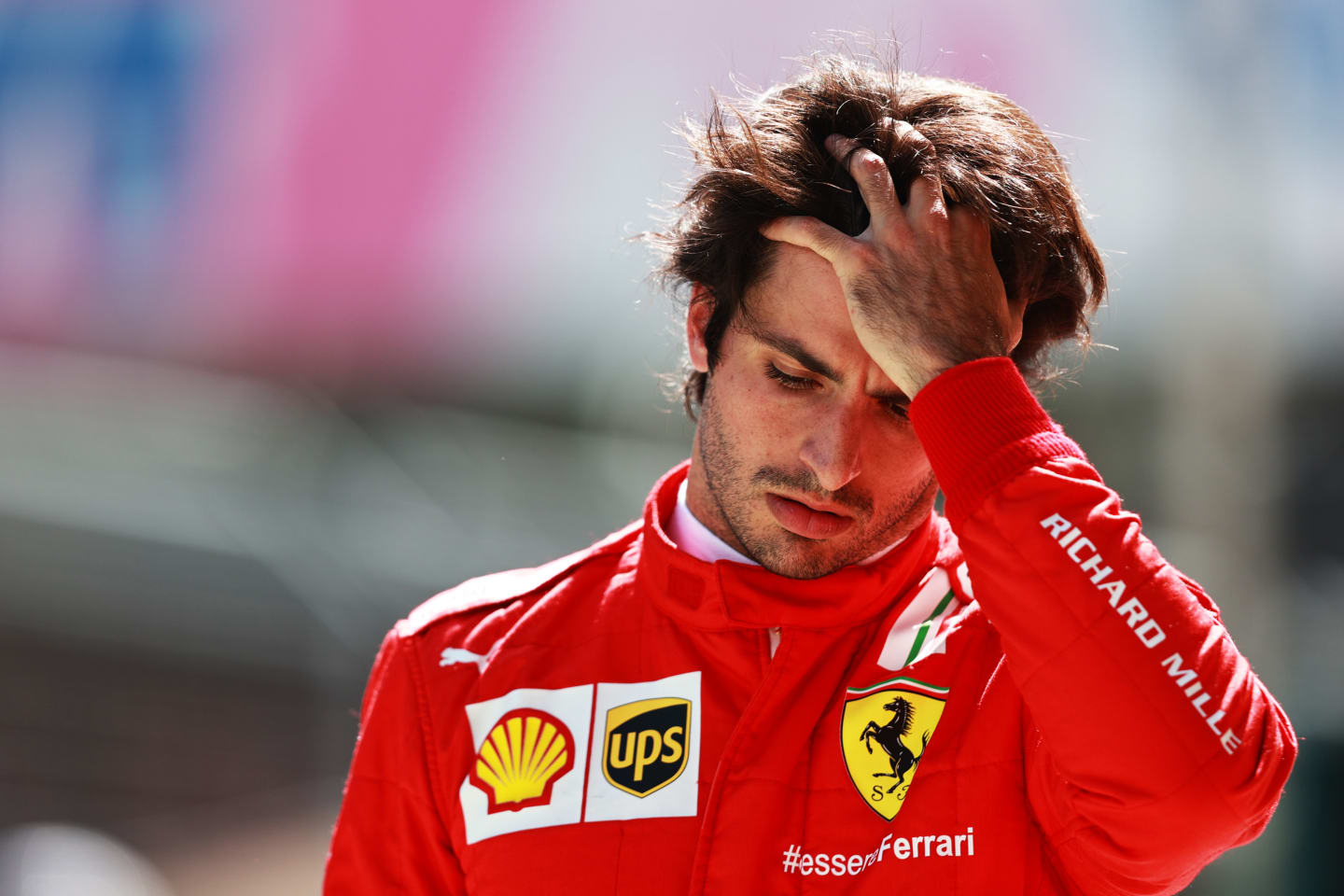 SPIELBERG, AUSTRIA - JULY 03: Carlos Sainz of Spain and Ferrari looks dejected in the Pitlane during qualifying ahead of the F1 Grand Prix of Austria at Red Bull Ring on July 03, 2021 in Spielberg, Austria. (Photo by Mark Thompson/Getty Images)