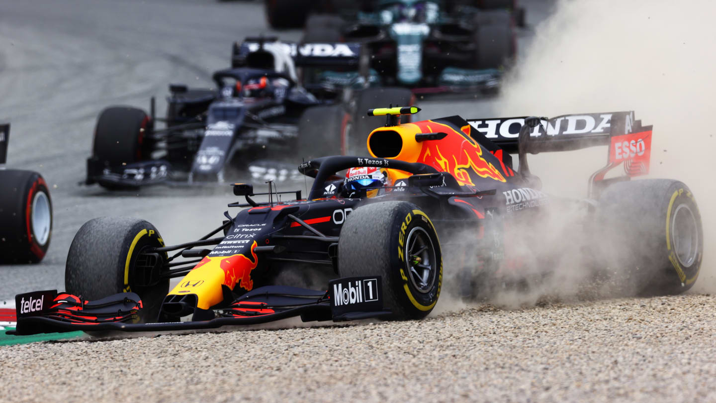 SPIELBERG, AUSTRIA - JULY 04: Sergio Perez of Mexico driving the (11) Red Bull Racing RB16B Honda runs wide during the F1 Grand Prix of Austria at Red Bull Ring on July 04, 2021 in Spielberg, Austria. (Photo by Clive Mason - Formula 1/Formula 1 via Getty Images)