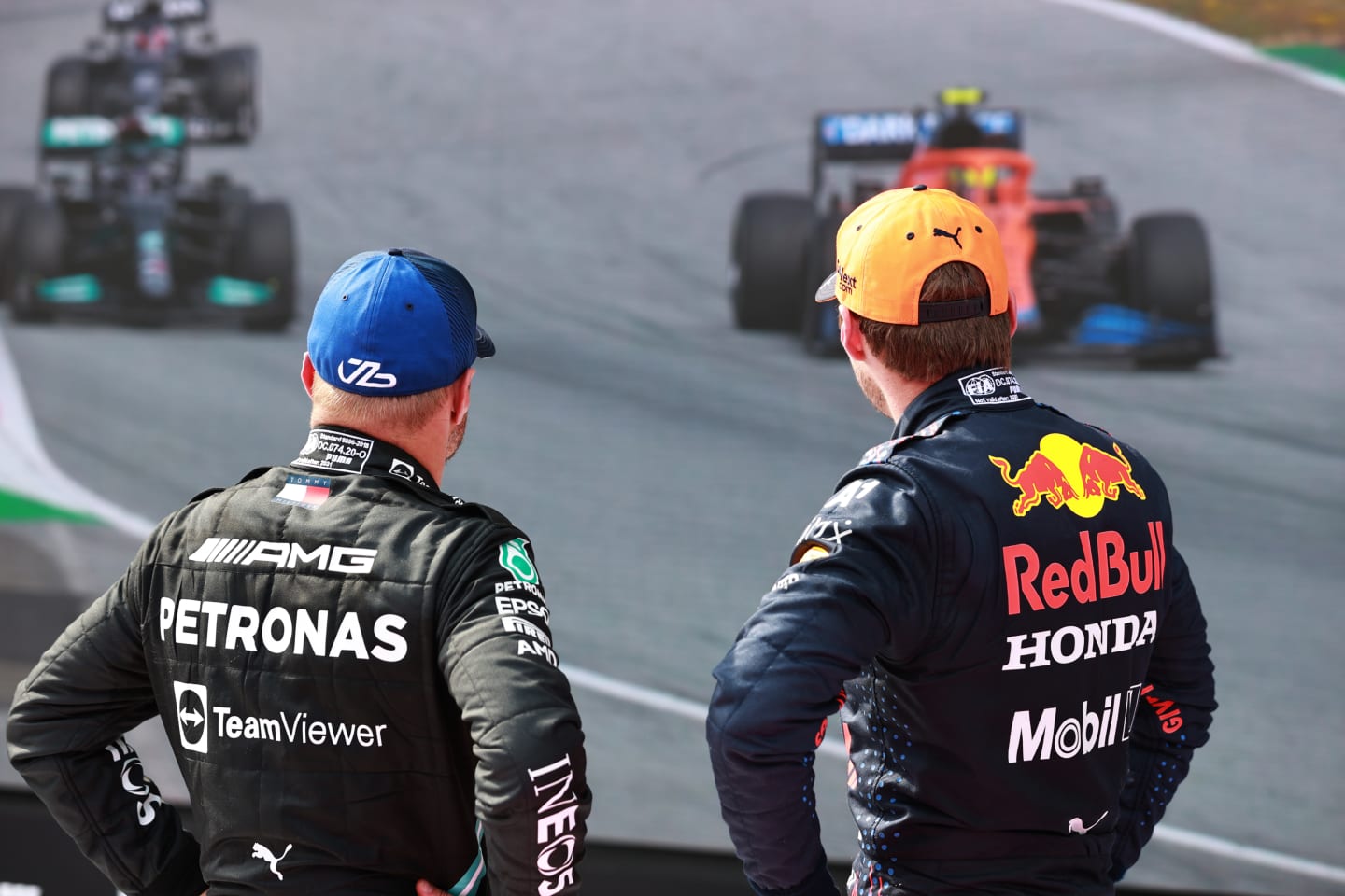 SPIELBERG, AUSTRIA - JULY 04: Race winner Max Verstappen of Netherlands and Red Bull Racing and second placed Valtteri Bottas of Finland and Mercedes GP talk in parc ferme during the F1 Grand Prix of Austria at Red Bull Ring on July 04, 2021 in Spielberg, Austria. (Photo by Mark Thompson/Getty Images)
