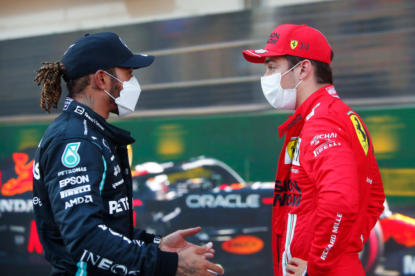 BAKU, AZERBAIJAN - JUNE 05: Second placed qualifier Lewis Hamilton of Great Britain and Mercedes GP talks with pole position qualifier Charles Leclerc of Monaco and Ferrari in parc ferme during qualifying ahead of the F1 Grand Prix of Azerbaijan at Baku City Circuit on June 05, 2021 in Baku, Azerbaijan. (Photo by Maxim Shemetov - Pool/Getty Images)
