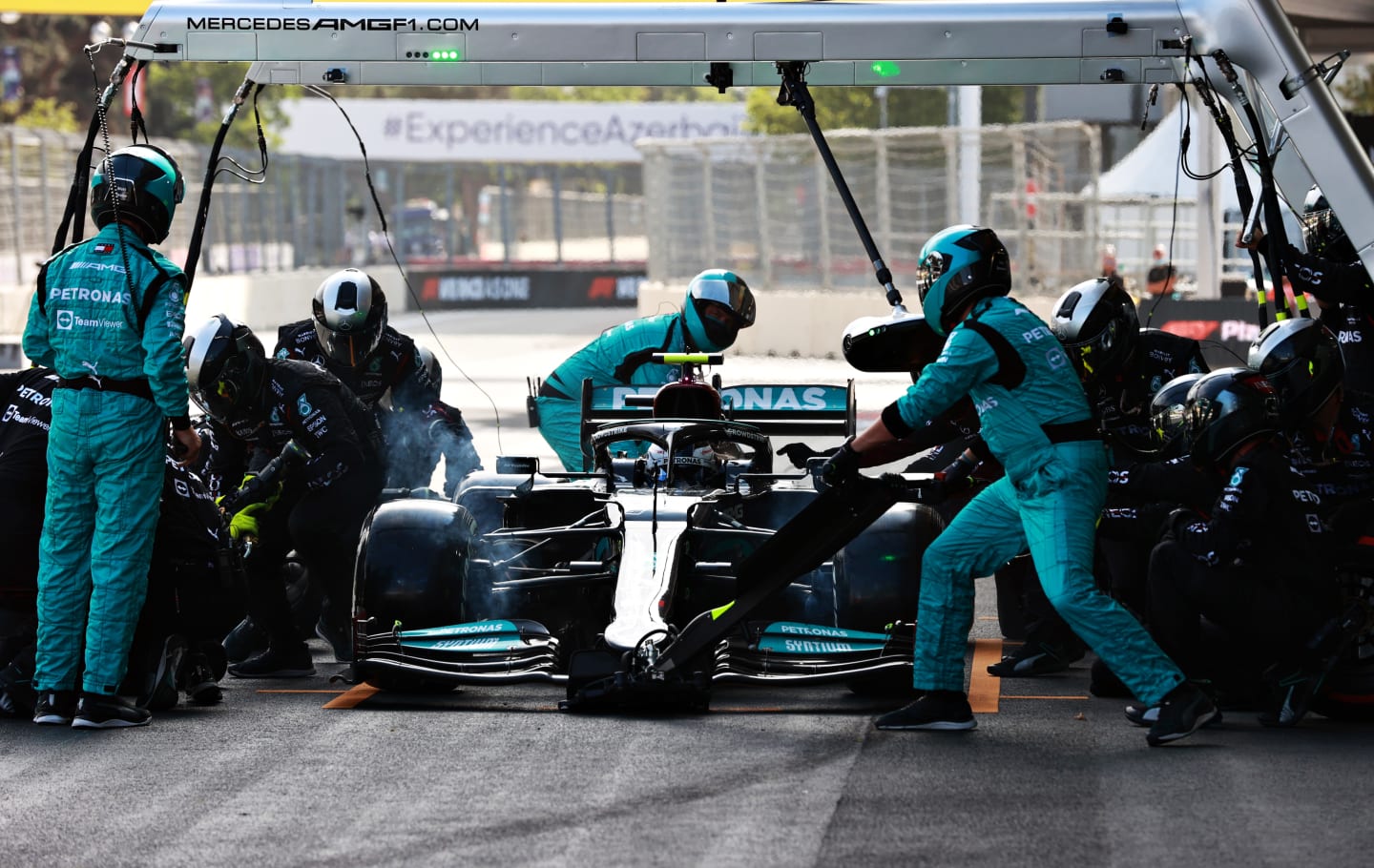 BAKU, AZERBAIJAN - JUNE 06: Valtteri Bottas of Finland driving the (77) Mercedes AMG Petronas F1 Team Mercedes W12 makes a pitstop during the F1 Grand Prix of Azerbaijan at Baku City Circuit on June 06, 2021 in Baku, Azerbaijan. (Photo by Mark Thompson/Getty Images)