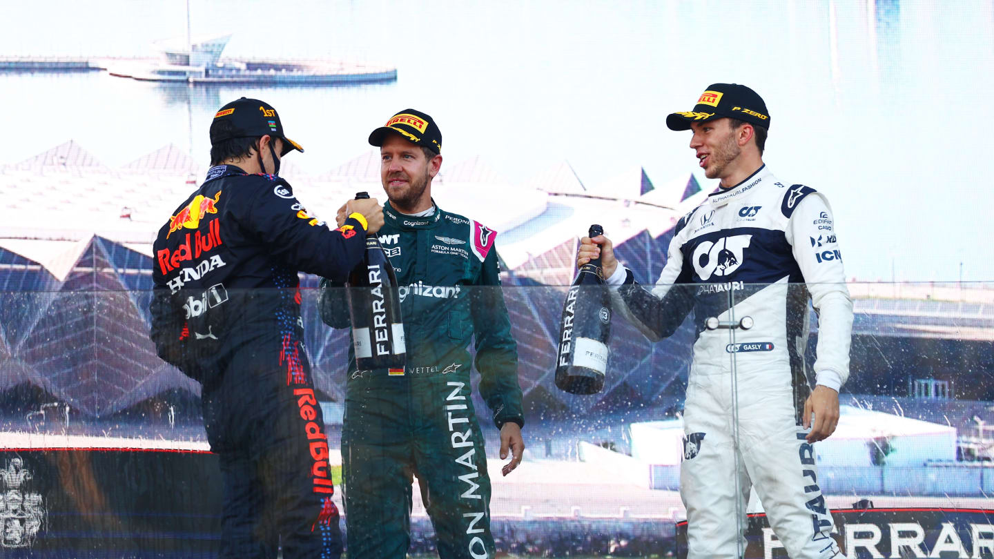 BAKU, AZERBAIJAN - JUNE 06: Race winner Sergio Perez of Mexico and Red Bull Racing, second placed Sebastian Vettel of Germany and Aston Martin F1 Team and third placed Pierre Gasly of France and Scuderia AlphaTauri celebrate on the podium during the F1 Grand Prix of Azerbaijan at Baku City Circuit on June 06, 2021 in Baku, Azerbaijan. (Photo by Dan Istitene - Formula 1/Formula 1 via Getty Images)