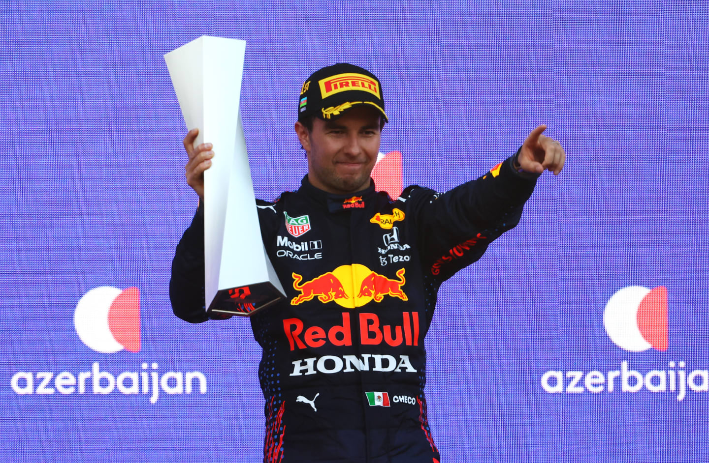 BAKU, AZERBAIJAN - JUNE 06: Race winner Sergio Perez of Mexico and Red Bull Racing celebrates on the podium during the F1 Grand Prix of Azerbaijan at Baku City Circuit on June 06, 2021 in Baku, Azerbaijan. (Photo by Francois Nel/Getty Images)