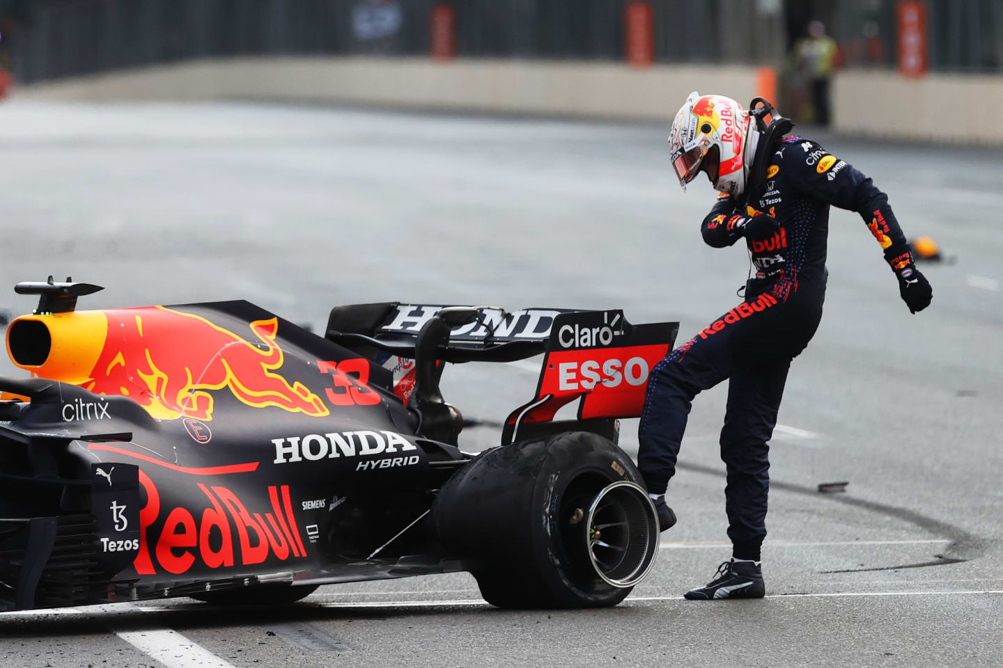BAKU, AZERBAIJAN - JUNE 06:Max Verstappen of Netherlands and Red Bull Racing kicks his tyre as he reacts after crashing during the F1 Grand Prix of Azerbaijan at Baku City Circuit on June 06, 2021 in Baku, Azerbaijan. (Photo by Clive Rose/Getty Images)