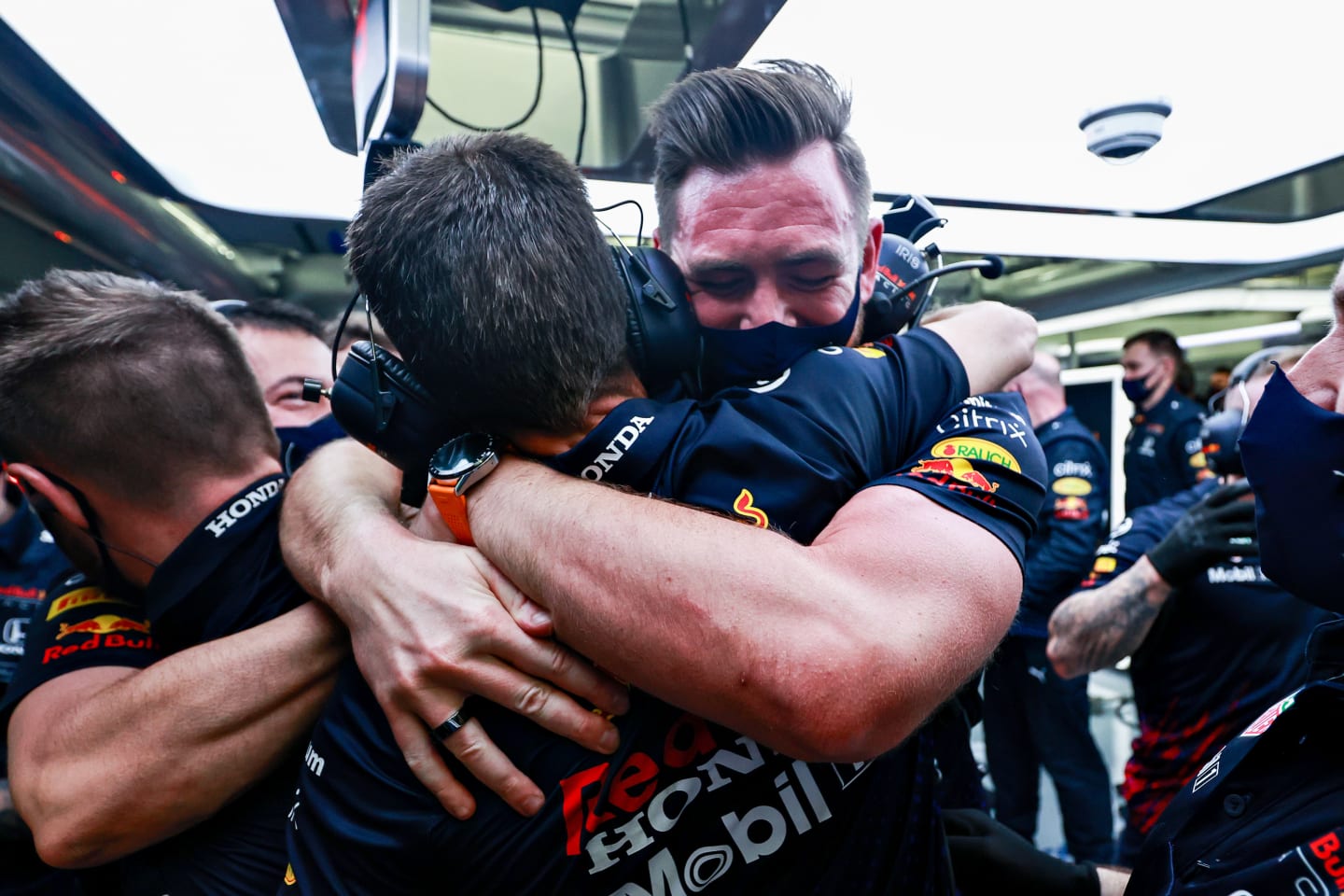 BAHRAIN, BAHRAIN - MARCH 27: The Red Bull Racing team celebrate the pole position of Max Verstappen of Netherlands and Red Bull Racing  during qualifying ahead of the F1 Grand Prix of Bahrain at Bahrain International Circuit on March 27, 2021 in Bahrain, Bahrain. (Photo by Mark Thompson/Getty Images)