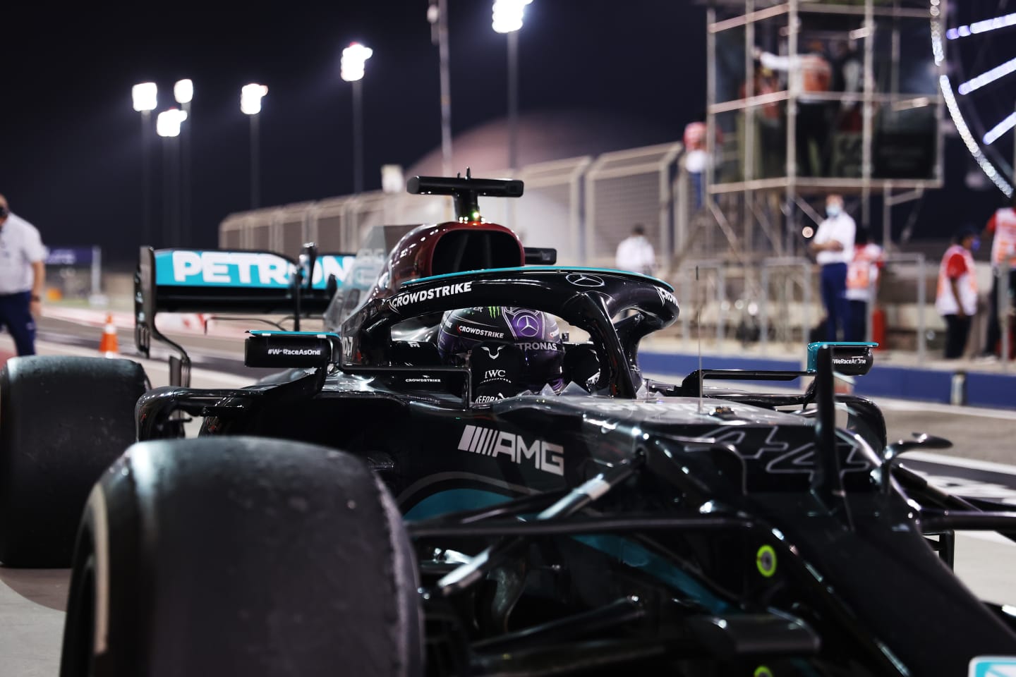 BAHRAIN, BAHRAIN - MARCH 28: Race Winner, Lewis Hamilton of Great Britain and Mercedes GP stops in parc ferme during the F1 Grand Prix of Bahrain at Bahrain International Circuit on March 28, 2021 in Bahrain, Bahrain. (Photo by Lars Baron/Getty Images)