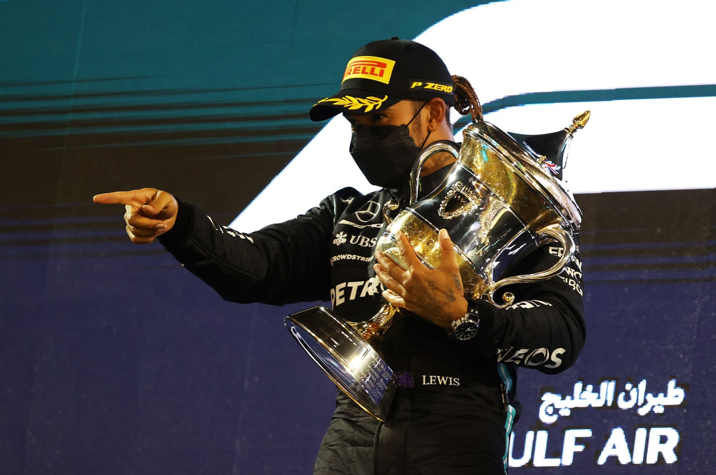 BAHRAIN, BAHRAIN - MARCH 28: Race winner Lewis Hamilton of Great Britain and Mercedes GP celebrates