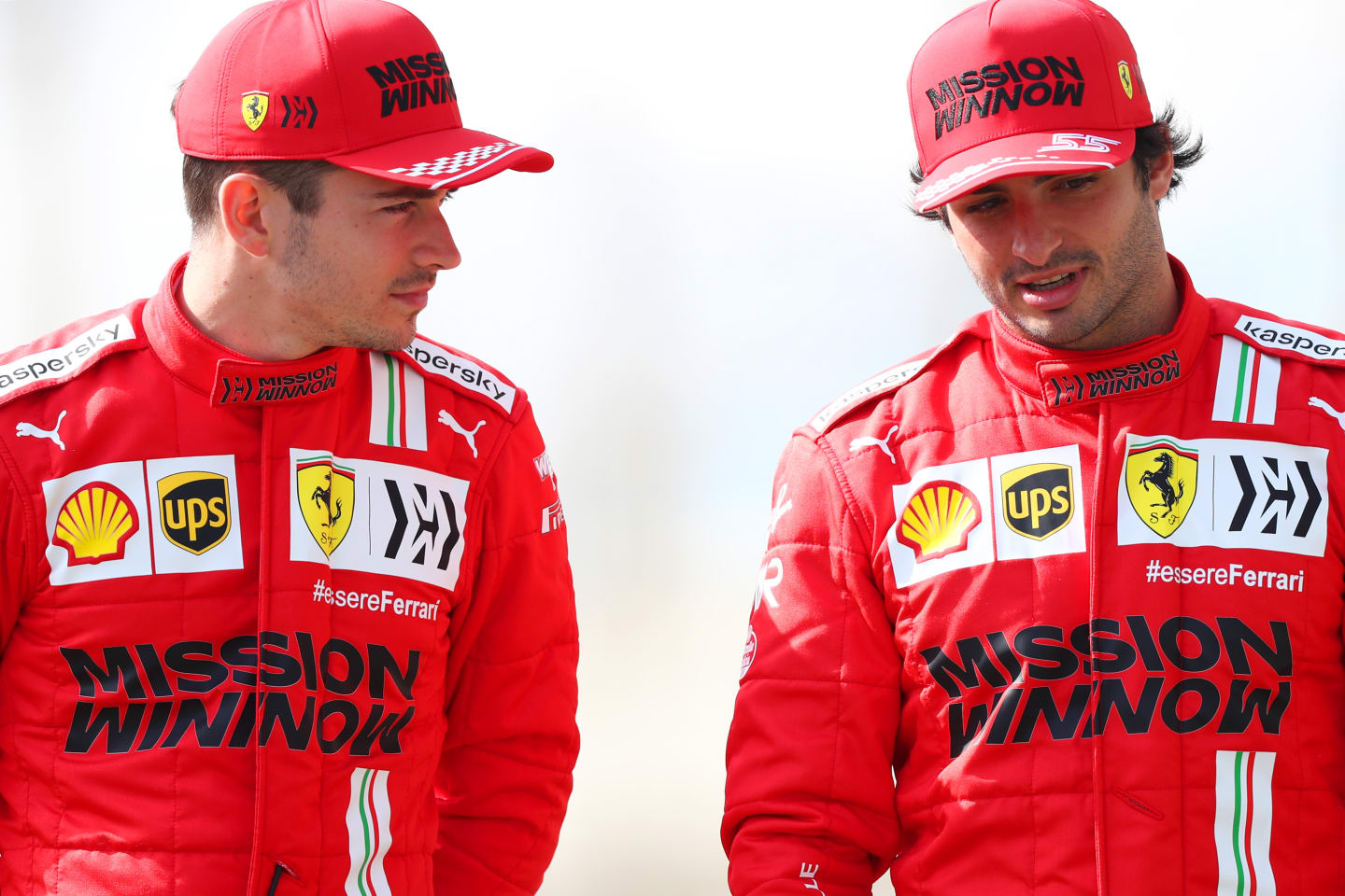 BAHRAIN, BAHRAIN - MARCH 12:  Charles Leclerc of Monaco and Ferrari speaks with team mate Carlos