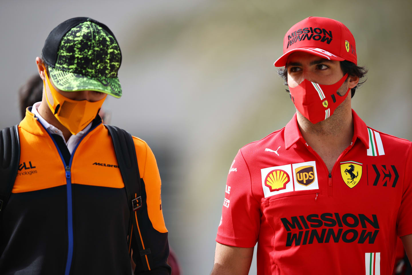 BAHRAIN, BAHRAIN - MARCH 13: Carlos Sainz of Spain and Ferrari (R) and Lando Norris of Great